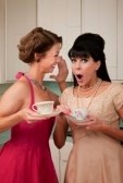 9270044-pretty-retro-caucasian-women-gossiping-over-coffee-in-kitchen (1)